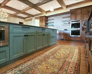 Glazed cabinet painting in farmhouse ranch kitchen, glazed kitchen island in turquoise teal blue by Paper Moon Painting, San Antonio cabinet painters near me