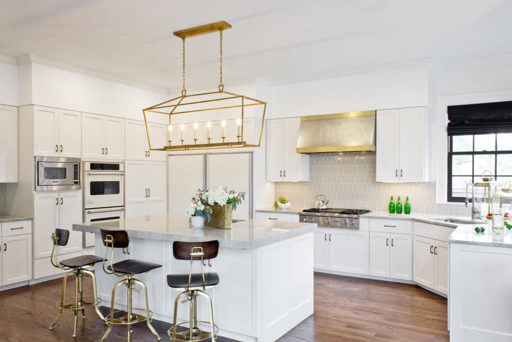 White kitchen cabinets in Benjamin Moore's Decorator's White, Paper Moon Painting company, Austin