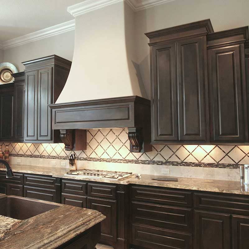 Formerly golder oak cabinets toned darker by Paper Moon Painting, cabinet painter