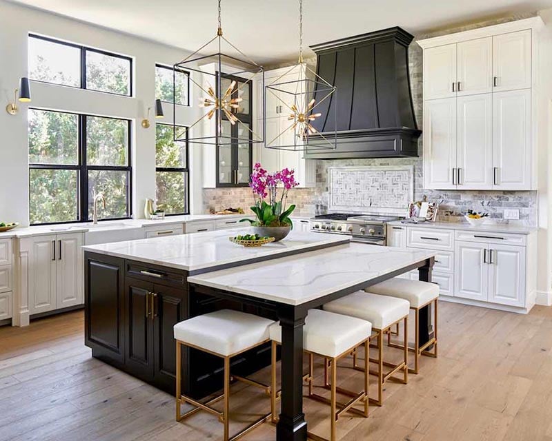 Painted kitchen cabinets in Sherwin Williams SW 7005 Pure White, black island in Benjamin Moore BM 2133-10 Onyx, Austin cabinet painters