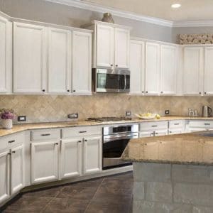 White painted glazed kitchen cabinets by Paper Moon Painting