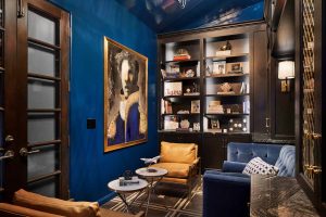 Lounge in dark blue lacquer walls and black cabinets, Paper Moon Painting, Alamo Heights