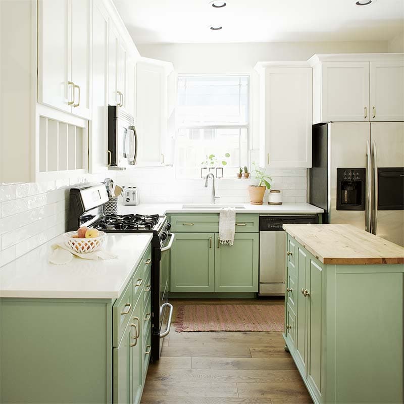 Green and white kitchen cabinets painted in BM Greenwich Village and SW Alabaster, Paper Moon Painting contractor, Austin