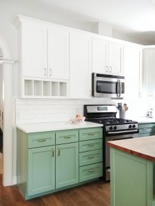 Side view of green  and white kitchen  cabinets paint BM 