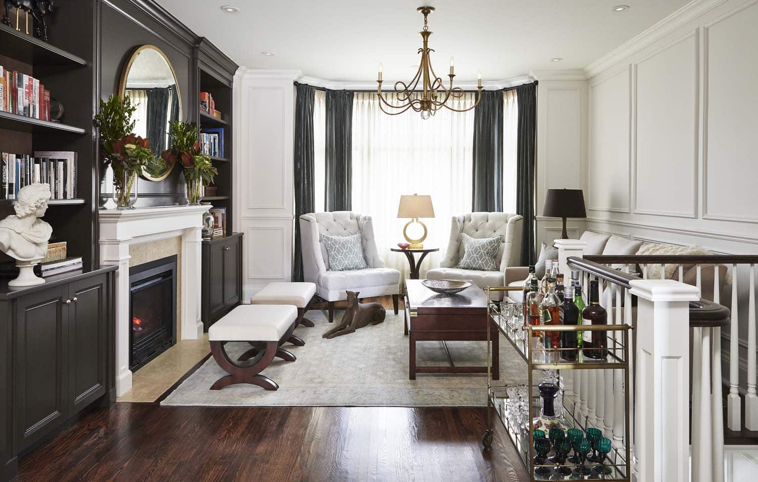 Image of living area with built in cabinets and fireplace, designed by Laura Stein Interiors.