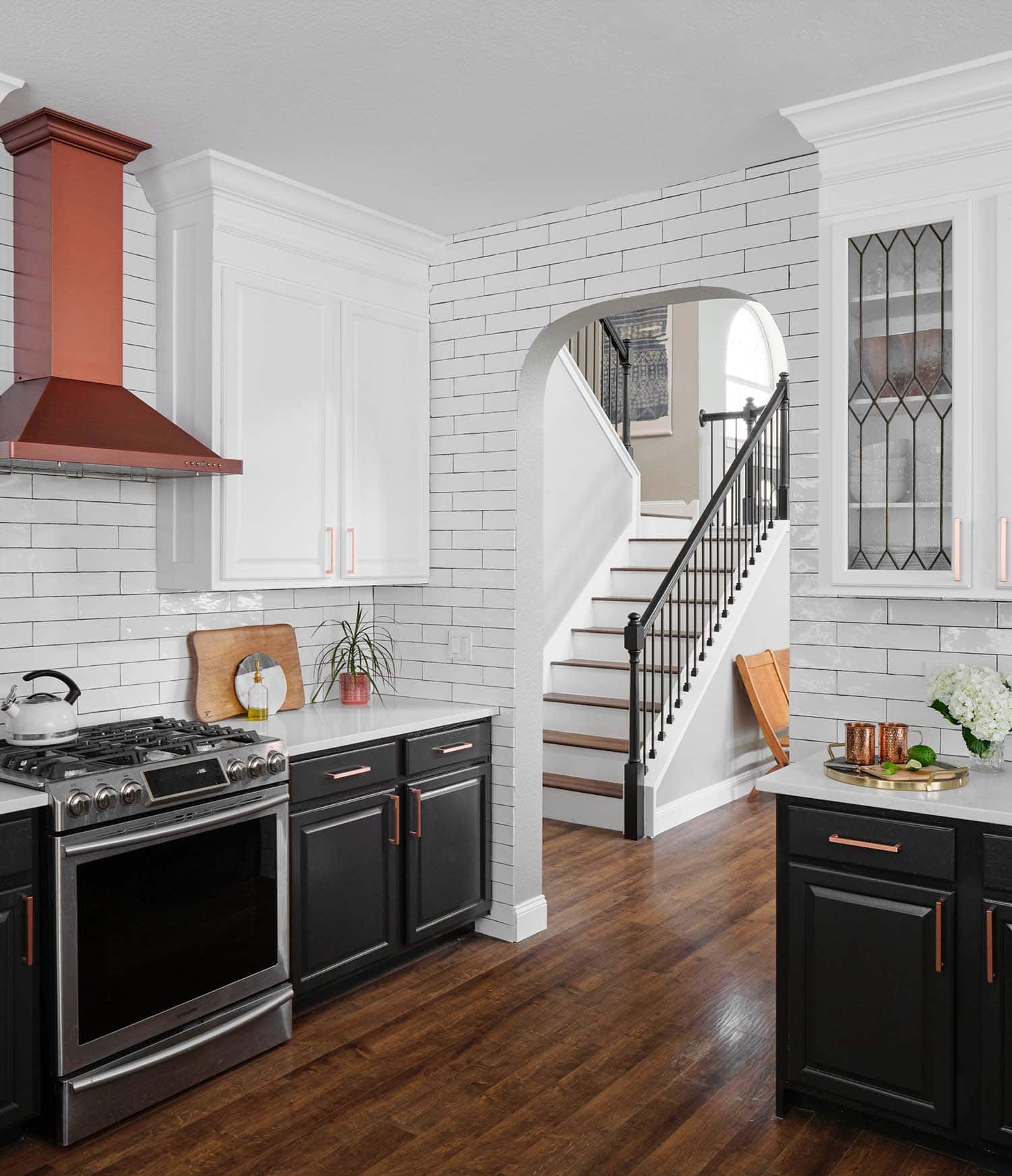 Black and white traditional kitchen, lower cabinets painted in Benjamin Moore Onyx, uppers in custom white, Paper Moon Painting, Austin