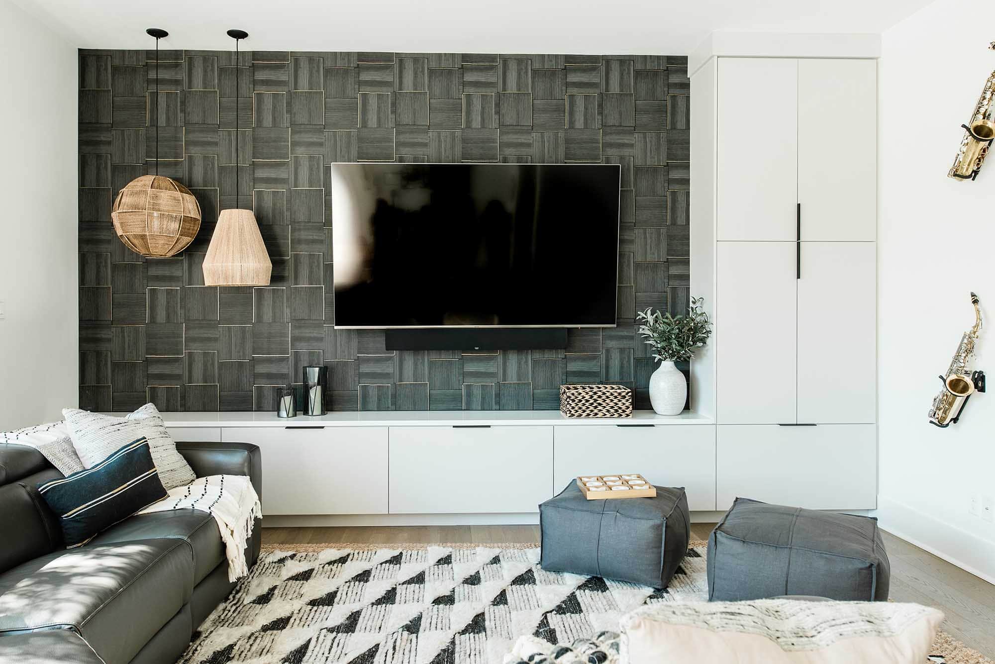 Wallpaper feature wall, dark grey graphic pattern, TV room, Alamo Heights wallpaper hanger