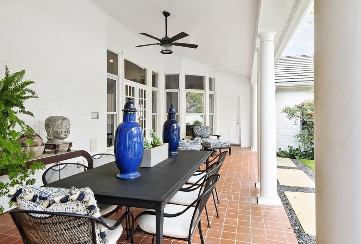 Back patio of white painted brick exterior of home, Benjamin Moore OC-152 Super White, the Dominion, San Antonio TX