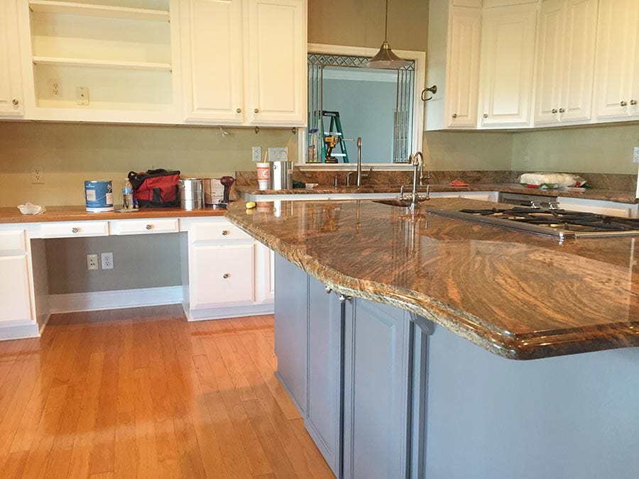 Kitchen cabinets before new tile, granite