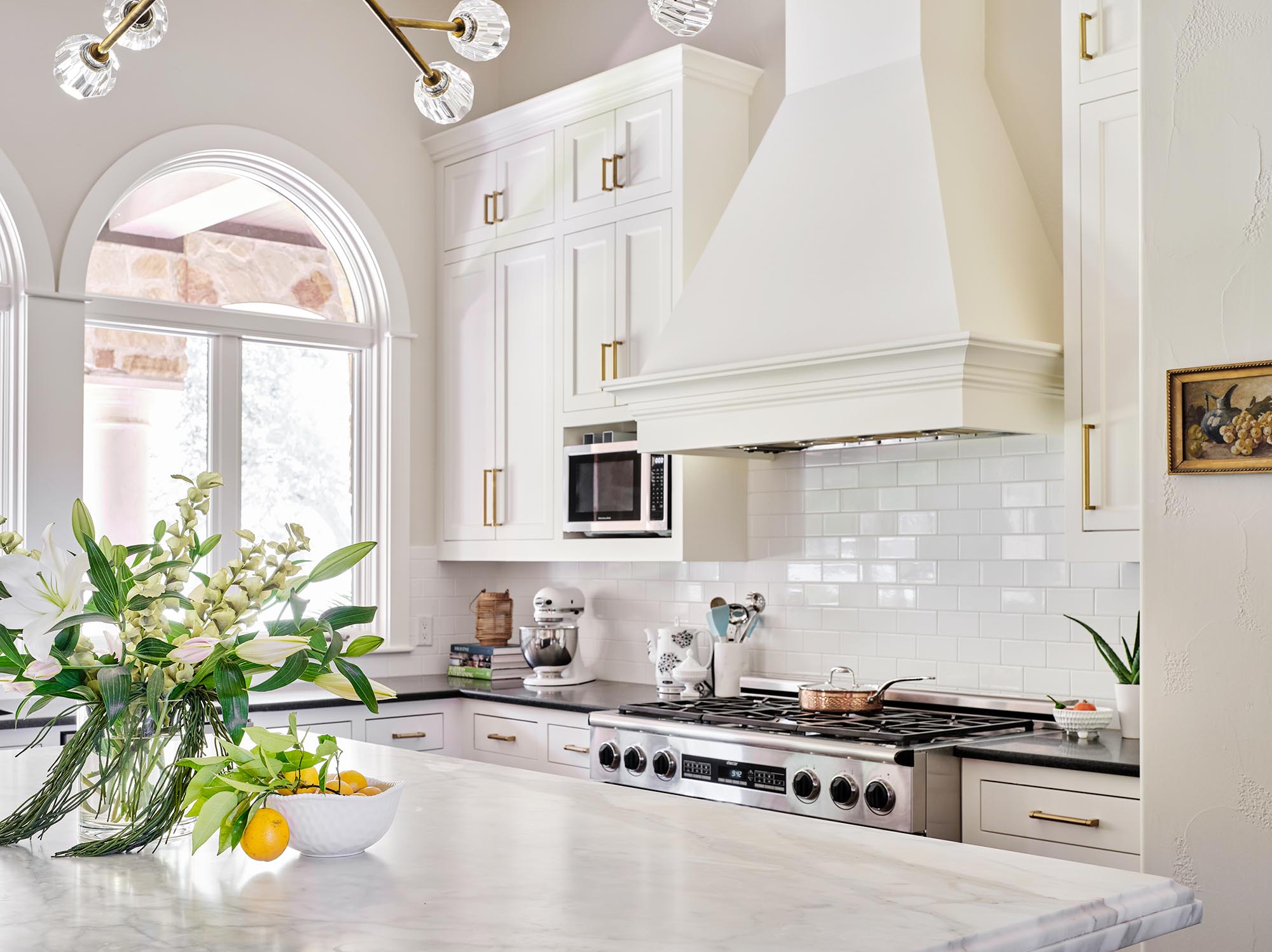 our favorite white kitchens example, Lake Austin white painted kitchen cabinets in Sherwin Williams Greek Villa, island in Iron Ore