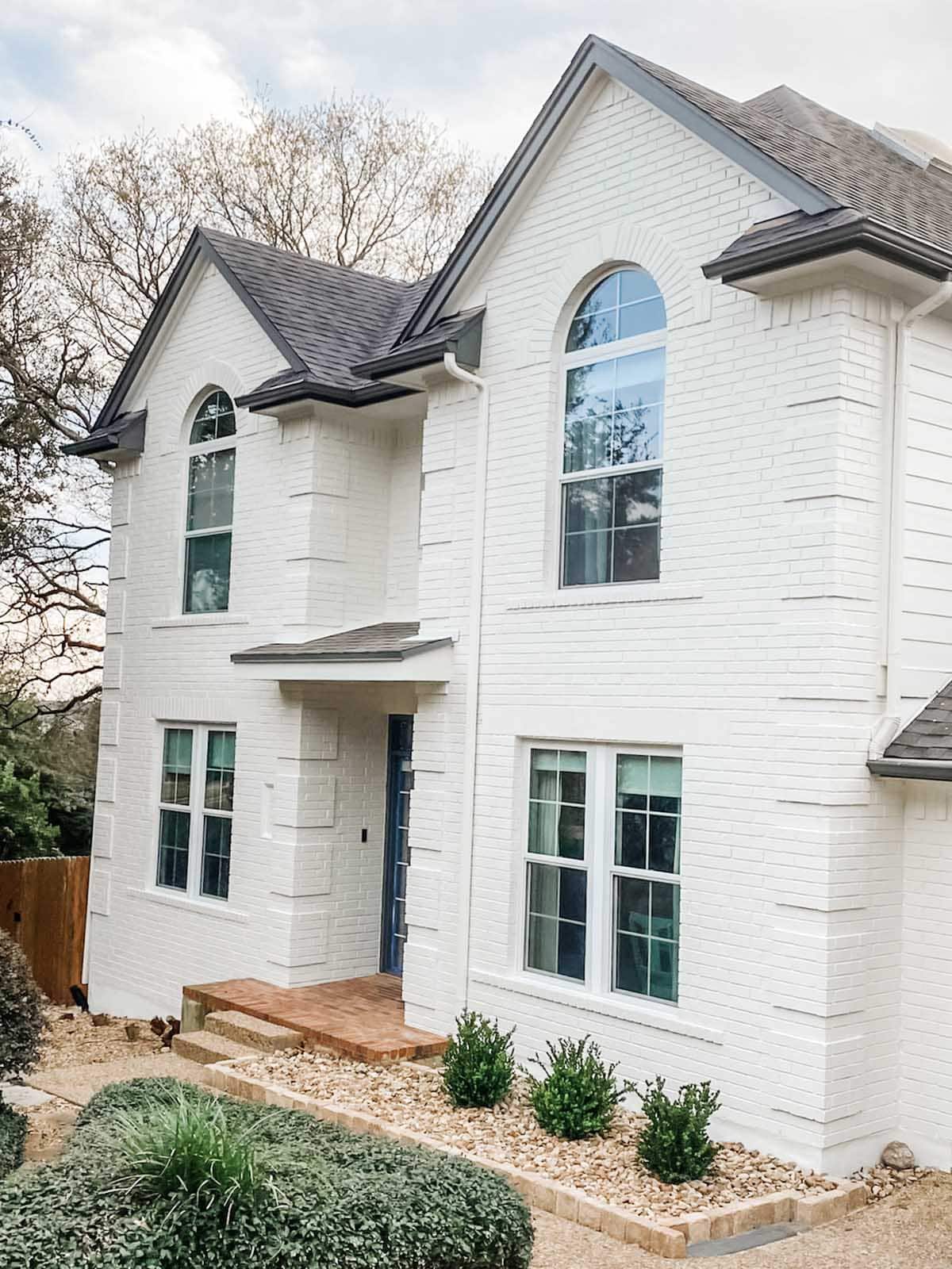 White painted brick exterior in Sherwin Williams Cotton White, Austin Round Rock, TX