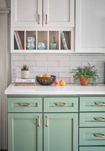 Green and white two-tone kitchen cabinets painted in BM Greenwich Village and SW Alabaster, Paper Moon Painting contractor, Austin Hyde Park