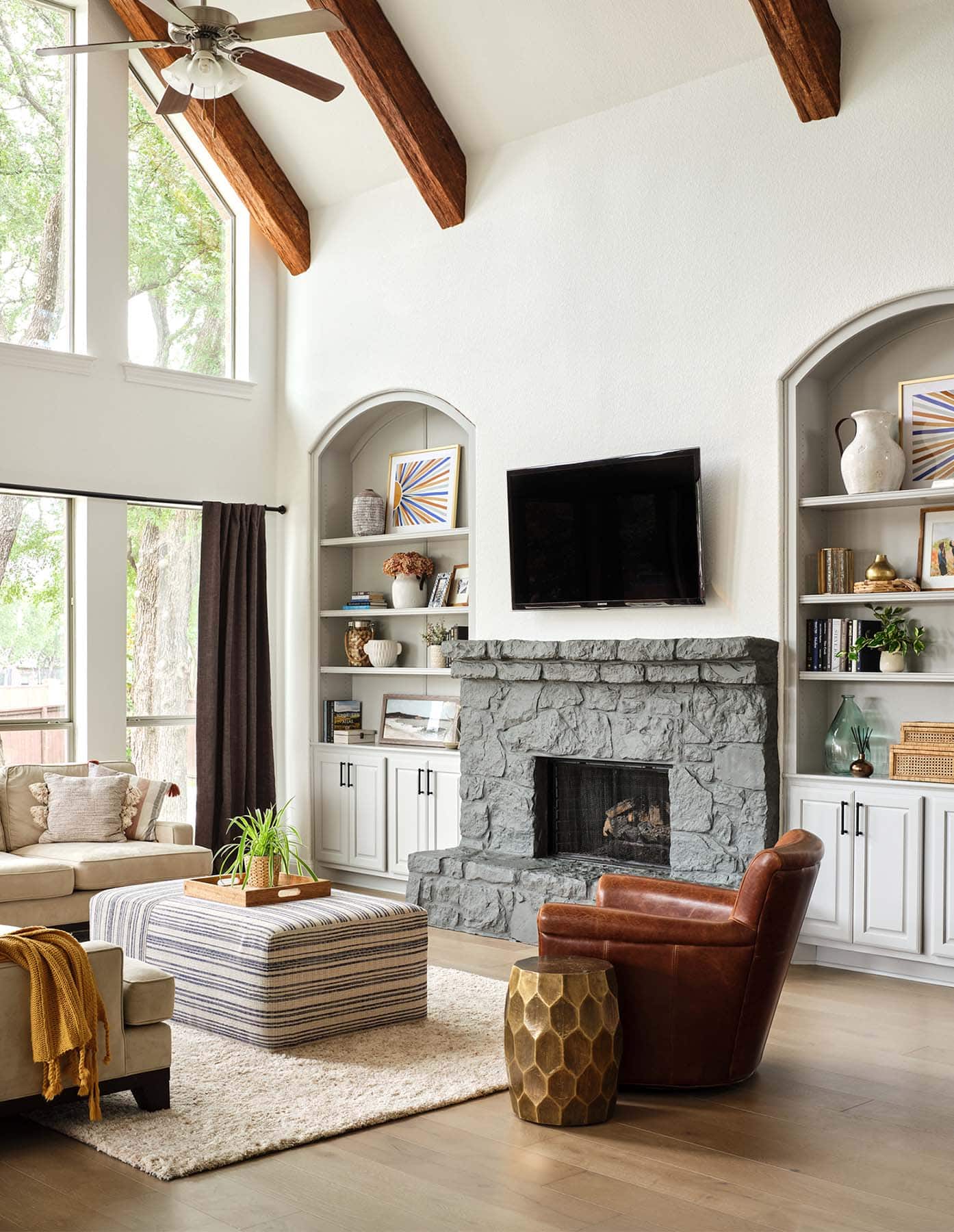 living-room-painted-built-in-bookshelves-in-sherwin-williams-light-french-gray-and-stone-fireplace-in-benjamin-moore-kendall-charcoal-austin-tx-home-painter-paper-moon-painting