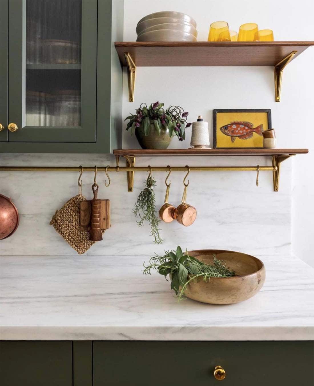 olive-green-cabinet-paint-color-close-up-with-brass-rail-and-open-shelves