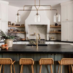 olive-green-cabinet-paint-color-on-island-in-white-kitchen-with-open-shelving