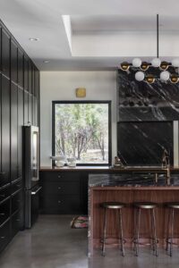 kitchen-cabinets-painted-in-sw-tricorn-black-walls-in-pure-white-blueberry-jones-design-avery-nicole-photo-paper-moon-painting-austin-tx