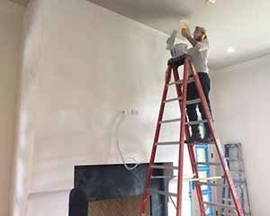 Paper Moon Painting painter Edgar applying interior plaster finish